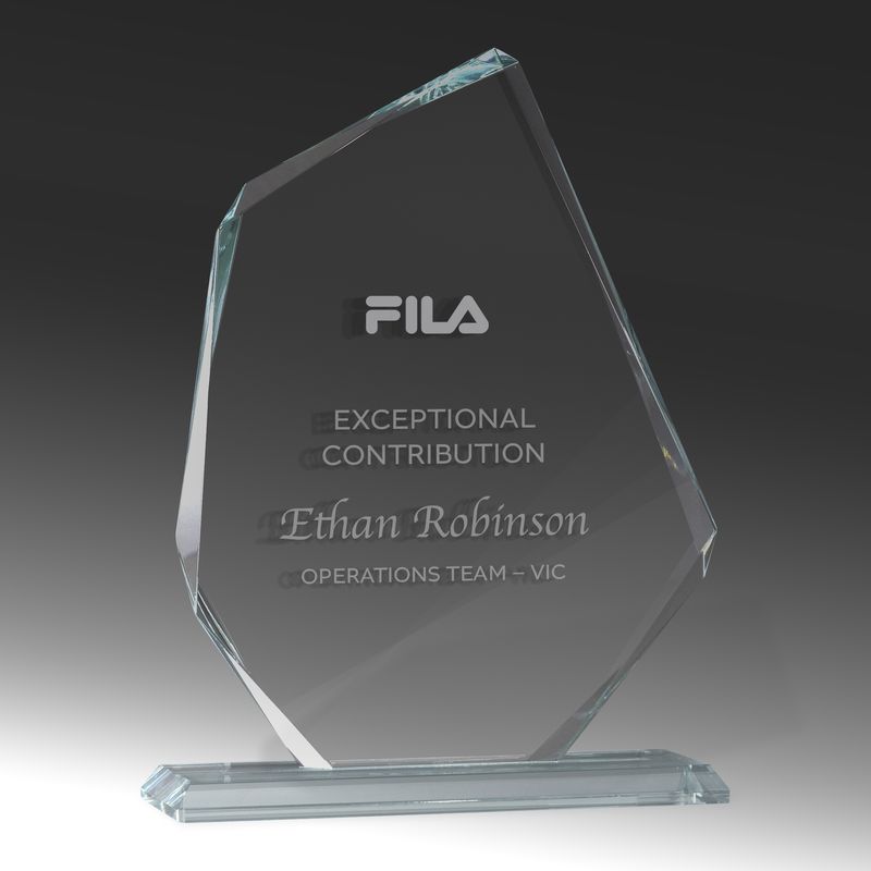A modern, geometric personalised glass award, contrasting sharply with traditional and historic golf trophies like the silver Claret Jug.